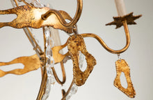 Load image into Gallery viewer, This exquisite petite chandelier features stunning hand-beaded details, candleabra bulbs, and an antique gold finish. With a dimmable light and graceful design, it is topped off with a regal touch, evocative of a crown. It's perfect for adding elegance to any room, with ornate hand-beaded accents and a shimmering antique gold finish. Enjoy the soft, adjustable lighting while appreciating the refined design.