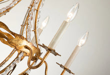 Load image into Gallery viewer, This exquisite petite chandelier features stunning hand-beaded details, candleabra bulbs, and an antique gold finish. With a dimmable light and graceful design, it is topped off with a regal touch, evocative of a crown. It's perfect for adding elegance to any room, with ornate hand-beaded accents and a shimmering antique gold finish. Enjoy the soft, adjustable lighting while appreciating the refined design.