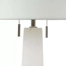 Load image into Gallery viewer, The Margaret Table Lamp is the ideal choice for those seeking a versatile and elegant addition to their living space. Made from natural alabaster, its smooth and translucent surface adds a timeless touch, while the gold metal accents bring a sense of luxury. Standing tall at 31 inches, this lamp is perfect for adding a sophisticated glow to any room, with its two bulbs providing ample light. Its classic quatrefoil design complements a variety of styles, making it a popular and stylish choice for those looki