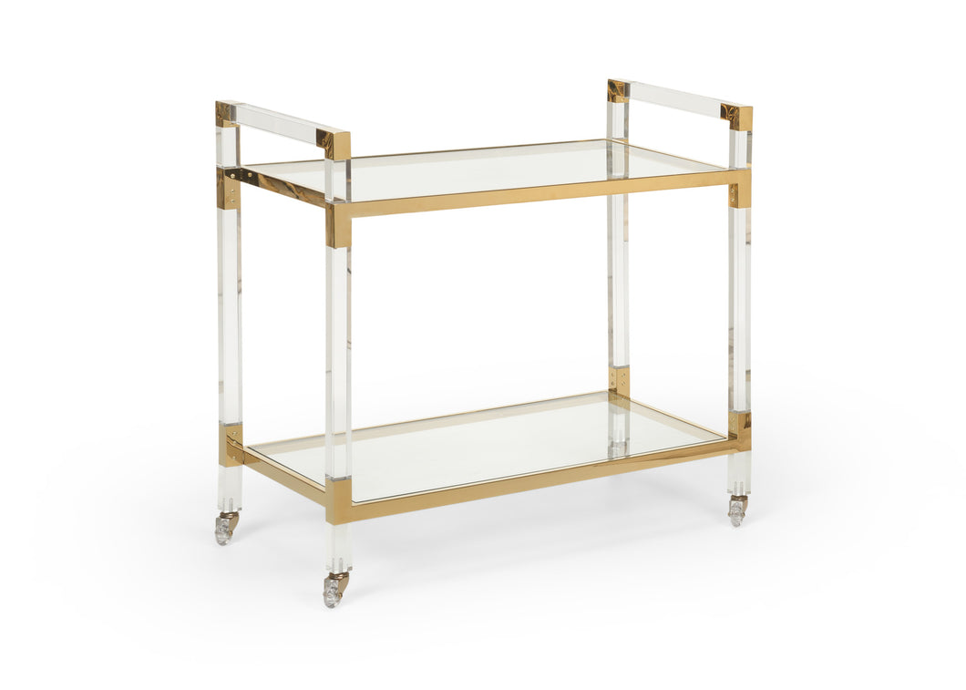 Featuring a sleek design, this bar cart boasts clear acrylic, clear tempered glass shelves, and polished brass finished iron edging. It is the perfect choice for all your essential entertaining needs.