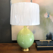 Load image into Gallery viewer, This handsome green ceramic table lamp conveys a colorful light-hearted charm paired with a traditional silhouette.
