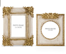 Load image into Gallery viewer, Transform your favorite photos into timeless pieces of art with the Antique Gold Photo Frames. Featuring intricate scrolling and accents of antiqued gold, these frames will add a touch of elegance to any space. The distressed cream frame adds a vintage touch, making it perfect for showcasing your cherished memories. 
