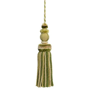 This key tassel adds a touch of history, romance, and texture with its soft cream color. Made from soft thread, it can be used to add an intriguing element to lamp pulls, cabinetry knobs, drapery, pillows, and more. Its versatile use makes it a perfect addition to any interior design.