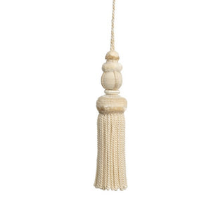 This key tassel adds a touch of history, romance, and texture with its soft cream color. Made from soft thread, it can be used to add an intriguing element to lamp pulls, cabinetry knobs, drapery, pillows, and more. Its versatile use makes it a perfect addition to any interior design.