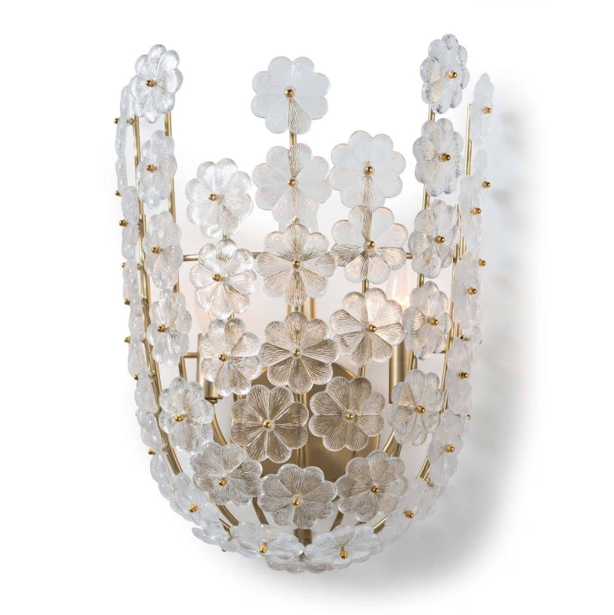 Crafted with precision and delicate attention to detail, the cast glass flowers on the Charlotte Sconce exude a stunning beauty that is truly breathtaking. Its elegant natural brass design makes it the perfect addition to any entryway, foyer, or dining room, adding a touch of feminine sophistication to any space.