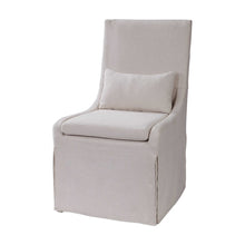 Load image into Gallery viewer, Crafted with simplicity in mind, this refined armless dining chair boasts a fitted slipcover in a neutral off-white linen blend. Its seat is cushioned for ultimate comfort and comes with an accompanying kidney pillow. The added performance treatment also makes it resistant to stains and soiling, ensuring long-lasting use.
