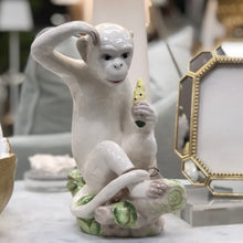 Load image into Gallery viewer, A delightful combination of whimsy and sophistication, this carefully crafted ceramic monkey adds a touch of eclectic personality to your stylish home.
