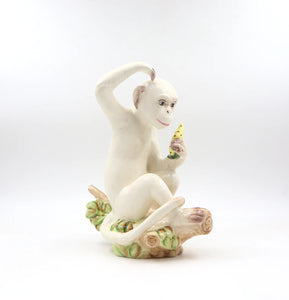 A delightful combination of whimsy and sophistication, this carefully crafted ceramic monkey adds a touch of eclectic personality to your stylish home.