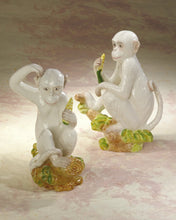 Load image into Gallery viewer, A delightful combination of whimsy and sophistication, this carefully crafted ceramic monkey adds a touch of eclectic personality to your stylish home.
