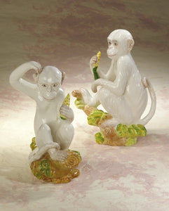 A delightful combination of whimsy and sophistication, this carefully crafted ceramic monkey adds a touch of eclectic personality to your stylish home.