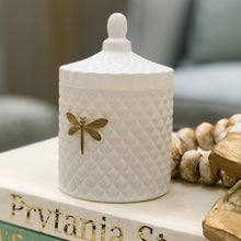 Load image into Gallery viewer, Introducing the Dragonfly Bella Candle - a luxurious vessel with a textured matte exterior and signature dragonfly design. This elegant vessel can be repurposed long after the candle has finished burning, thanks to its premium blend wax and fine fragrance oils.
