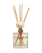 Load image into Gallery viewer, Discover the power of scent in any space with our Dragonfly Floral Reed Diffuser. Our exquisite diffusers feature a single handcrafted wood flower for optimal diffusion. The porous rattan reeds and delicate wood petals efficiently absorb and release fragrance. Please note that the appearance of each wood flower may vary slightly due to its handmade nature.
