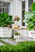 Load image into Gallery viewer, Featuring a sleek design, this bar cart boasts clear acrylic, clear tempered glass shelves, and polished brass finished iron edging. It is the perfect choice for all your essential entertaining needs.
