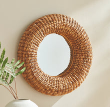 Load image into Gallery viewer, A classic weave in water hyacinth, this gorgeous mirror is made for the casual, transitional space. Mirrors add a sense of light and reflection to a space. The thick woven frame and natural warmth and texture are sure to enhance any environment.
