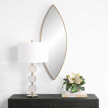 Load image into Gallery viewer, The Ellipse Mirror showcases a petite iron frame that encircles a floating mirror with polished edges. Its deep design highlights the antiqued golden bronze finish.
