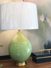 Load image into Gallery viewer, This handsome green ceramic table lamp conveys a colorful light-hearted charm paired with a traditional silhouette.
