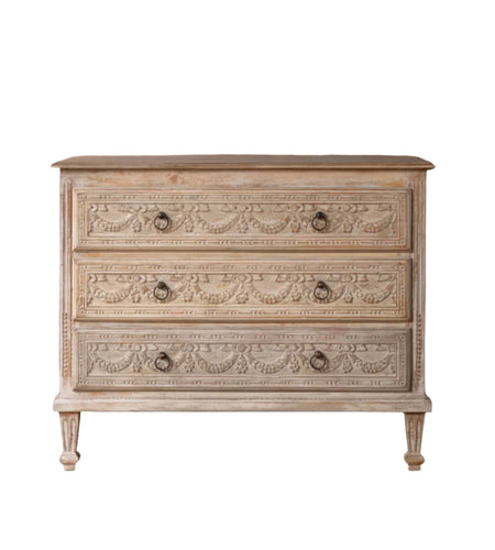 The Garland Estate Chest with a beautiful carved facade and a warm natural finish.