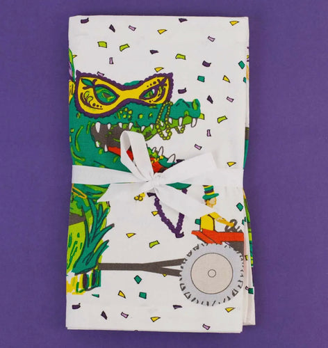 Get ready to party and show off your Mardi Gras spirit with this funky Gator Parade table runner! It's sure to be a conversation starter and add some festive flair to your celebrations. Nola artist, french quarter, new orleans art, new orleans artist, Southern artist, Louisiana artist, Gulf South artist, original art, artist, mardi gras art, mardi gras, mardi gras floats, carnival