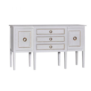 With its undeniable popularity, our Gilded Hampton Sideboard needs no introduction. This luxurious piece is a crowd favorite, featuring three practical pull drawers and two roomy cabinets adorned with gilded accents and ornate gold hoop pulls. It comes in a stuccoed white finish, making it the perfect addition to a sophisticated and opulent modern setting.