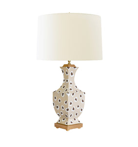 This handpainted lamp is perfect for any room in your home. Its unique brown leopard pattern and silk cream shade adds a touch of exotic elegance to your decor.