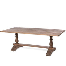 Load image into Gallery viewer, The elegant Giselle pine table comfortably accommodates 8 people. Its sturdy construction features a classic trestle and baluster base, reminiscent of a 17th-century banquet table, making it the perfect setting for hosting friends and family for a grand meal.
