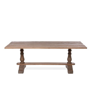 The elegant Giselle pine table comfortably accommodates 8 people. Its sturdy construction features a classic trestle and baluster base, reminiscent of a 17th-century banquet table, making it the perfect setting for hosting friends and family for a grand meal.