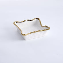 Load image into Gallery viewer, Enhance the visual appeal and sophistication of your dining area with this stunning cocktail napkin holder. Doubles as servingware to present delectable pastries and fresh fruit. Made of high-quality white porcelain with shimmering gold beads made of titanium.
