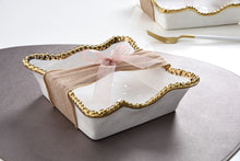 Load image into Gallery viewer, Enhance the visual appeal and sophistication of your dining area with this stunning cocktail napkin holder. Doubles as servingware to present delectable pastries and fresh fruit. Made of high-quality white porcelain with shimmering gold beads made of titanium.
