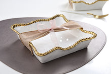 Load image into Gallery viewer, Enhance the visual appeal and sophistication of your dining area with this stunning luncheon napkin holder. Doubles as servingware to present delectable pastries and fresh fruit. Made of high-quality white porcelain with shimmering gold beads made of titanium.
