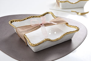 Enhance the visual appeal and sophistication of your dining area with this stunning luncheon napkin holder. Doubles as servingware to present delectable pastries and fresh fruit. Made of high-quality white porcelain with shimmering gold beads made of titanium.