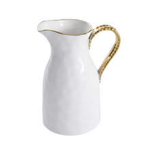 Load image into Gallery viewer, This elegant pitcher serves as both a stylish centerpiece and a practical vessel for drinks. It exudes sophistication with its gleaming white high-fired porcelain and stunning gold titanium rim and handle, making it the perfect balance between formal and hospitable.
