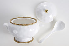 Load image into Gallery viewer, Our Golden Beaded Soup Tureen Ladle set is designed for effortless serving of your favorite soups and stews. Upgrade your dining experience with this elegant and functional set. Made of high-quality white porcelain with shimmering gold beads made of titanium.
