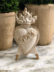 This stunning Immaculate Heart of Mary figurine is designed to be displayed easily and elegantly. These exquisite pieces are crafted by hand and permanently mounted on ceramic easels, coated in a beautiful antique white glaze and delicately accented with gold. Create a stunning display with our iconographic easel collection, either as a group or individually.