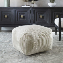 Load image into Gallery viewer, Crafted with 100% wool, this pouf features a soft ivory color and geometric accents. The oversized design makes it ideal for use as a footrest or extra seating, providing both comfort and style to any living space.
