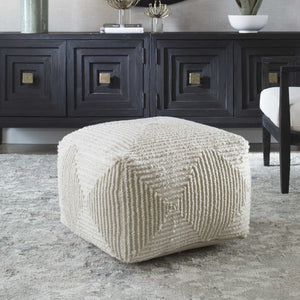 Crafted with 100% wool, this pouf features a soft ivory color and geometric accents. The oversized design makes it ideal for use as a footrest or extra seating, providing both comfort and style to any living space.