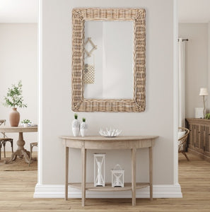 This stunning mirror is tailored for open concept spaces. Designed with a large gauge woven rattan frame, it exudes sophistication. Whether displayed horizontally or vertically, it is a magnificent addition to any bedroom, entryway, or foyer.