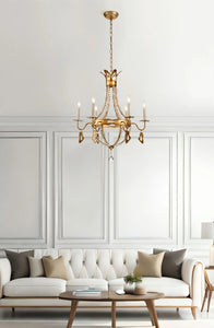 This exquisite petite chandelier features stunning hand-beaded details, candleabra bulbs, and an antique gold finish. With a dimmable light and graceful design, it is topped off with a regal touch, evocative of a crown. It's perfect for adding elegance to any room, with ornate hand-beaded accents and a shimmering antique gold finish. Enjoy the soft, adjustable lighting while appreciating the refined design.