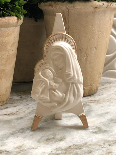 This stunning Madonna & Child figurine is designed to be displayed easily and elegantly. These exquisite pieces are crafted by hand and permanently mounted on ceramic easels, coated in a beautiful antique white glaze and delicately accented with gold. Create a stunning display with our iconographic easel collection, either as a group or individually. 