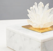 Load image into Gallery viewer, This elegant marble jewelry box is expertly hand-crafted, adding a touch of sophistication to any dressing table. Featuring a cluster of natural Brazilian clear quartz points, it serves as both a luxurious storage option and incorporates the healing and energizing qualities of quartz into your jewelry collection.
