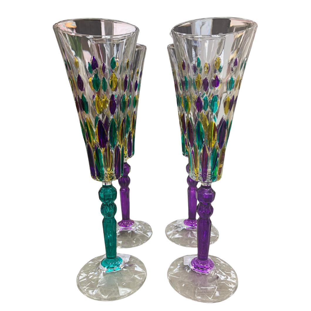 Sip in style this Mardi Gras with these colorful venetian crystal champagne flutes, hand-painted in vibrant shades of purple, green, and gold. Raise a toast to elegance and whimsy with each dazzling sip.