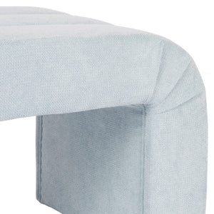 The Mercer channeled bench's graceful silhouette adds an elegant touch to any space, while its performance light blue chenille upholstery enhances its durability and comfort.