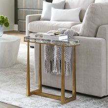 Load image into Gallery viewer, Experience true luxury with the exquisite Midas Accent Table. Crafted with textured antique gold finish iron legs, this table expertly supports a thick crystal top for an elegant touch to any room.
