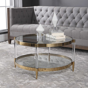 The Monroe Coffee Table is a glamorous addition to any space. It boasts a gold plated stainless steel frame, paired with clear glass and acrylic legs, complete with tapered feet for added elegance.