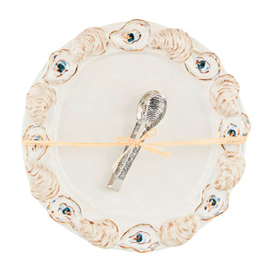 Add a touch of glamour to your next seafood soirée with this stoneware platter set that includes stainless steel oyster tongs. Each platter features a layered stoneware oyster shell rim accented with gilding that adds a unique and playful touch to your presentation. Get ready to shuck and serve in style!
