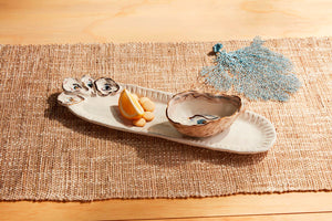 Get ready to shell-ebrate with this 2-piece stoneware set! The tray features a hand-painted and dimensional oyster shell design, while the coordinating oyster shell dip cup is just shucking perfect!
