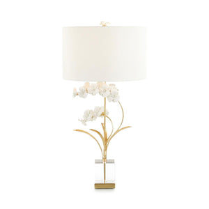 The Perse table lamp is a remarkable blend of natural elements and contemporary aesthetics. Elaborate porcelain petals are expertly crafted and upheld by slender brass stems finished in gold leaf. The lamp stands on a base made of clear crystal and adorned with brass accents. A polished brass neck, along with a floral porcelain finial, adds the perfect finishing touch. Features a convenient three-way switch.