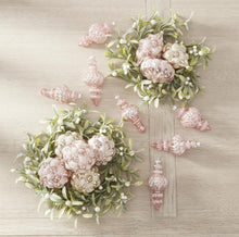 Load image into Gallery viewer, With its textured bead design and pink mercury wash, this ornament exudes a sense of timeless sophistication and opulence. Hang it on your tree for a royal touch, place it as the centerpiece of your holiday decorations, or add it to a garland for a celestial shimmer.
