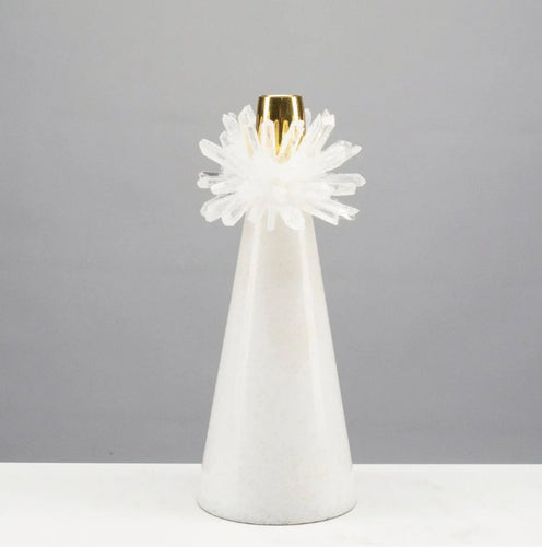 Our Quartz Cluster Candle Holder combines expert craftsmanship with stunning design. Each holder is individually hand-made and boasts a beautiful brass ring on a sleek marble base. Enhance your decor and create a cozy atmosphere with this truly unique piece.