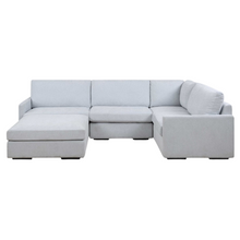 Load image into Gallery viewer, A modern silhouette that offers style and a comfortable place to curl up. The Refuge modular collection is crafted with premium, high durability foam cores and synthetic down wrap. Featuring the patented RidgEraser technology to ensure consistent comfort between cushions. Upholstered in a finely textured, cleanable polyester in light cloud blue. 
