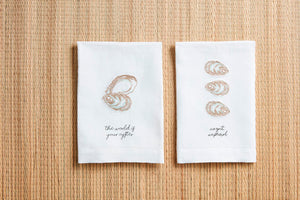 This embroidered linen towel features stylish hemstitching and a playful oyster design. Perfect for adding some fun to your kitchen!